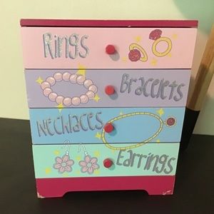 Children’s wood four drawer jewelry chest.
